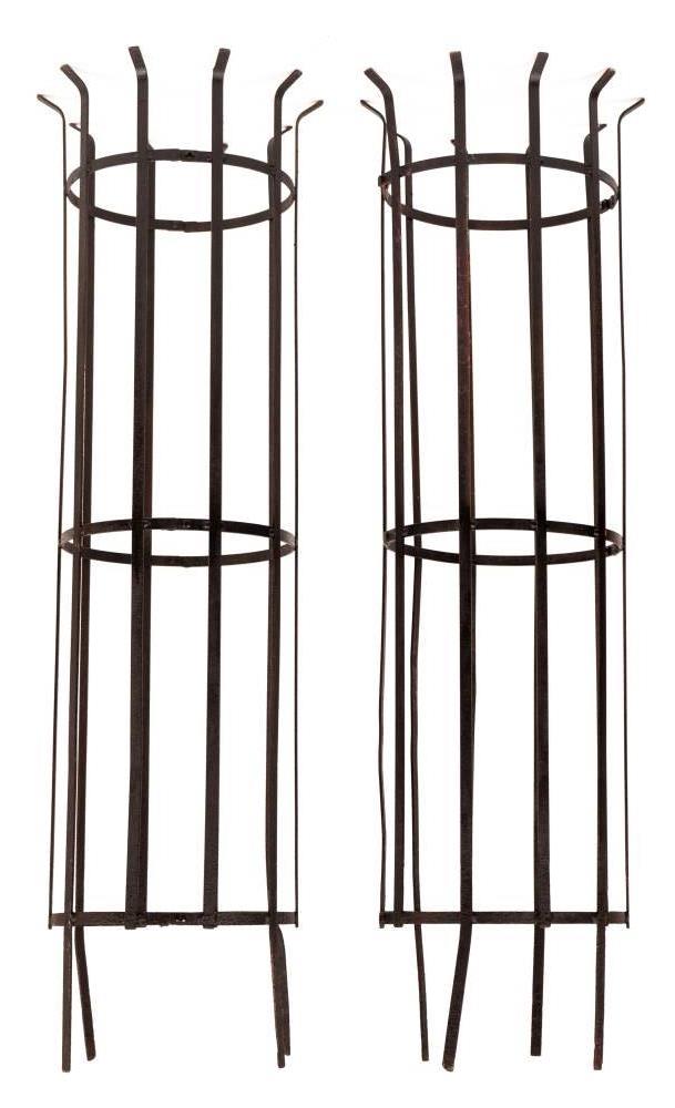 A pair of wrought iron tree guards:, of cylindrical lattice design, 174cm (5ft 8 1/4in) high,