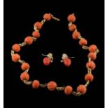 A carved coral bead,