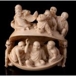 A large Japanese carved ivory netsuke of a clam,