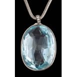 An oval blue topaz single-stone pendant: the faceted oval pale blue topaz approximately 37mm long x