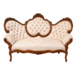 A 19th Century Continental carved beech settee:,