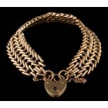 A 9ct gold bracelet with heart-shaped padlock clasp and safety chain: approximately 23gms gross