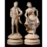 A pair of Continental carved ivory figures,