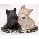 A mid 20th century 'Black & White' Scotch whisky advertising model of two Terriers on a demi lune