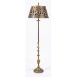An 20th century brass hunting theme standard lamp: the circular brass shade with piecework and