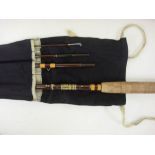 A Hardy 'Smuggler' No 6 8ft / 244cm fishing rod in canvas bag and associated leather rod case.