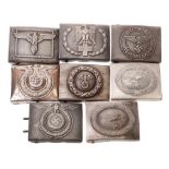 A collection of eight reproduction German belt buckles.