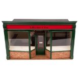 A wooden scale model of green grocers 'A Merchant & Son': with green glazed double fronted window