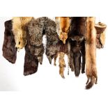 A collection of various mid to late 20th century fur stoles and hats.