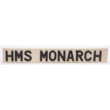 A scratch built ship's name plate 'HMS Monarch': black plastic letters on a white painted board,