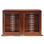 A late 19th/early 20th century mahogany and glazed mahogany microscope slide cabinet with a