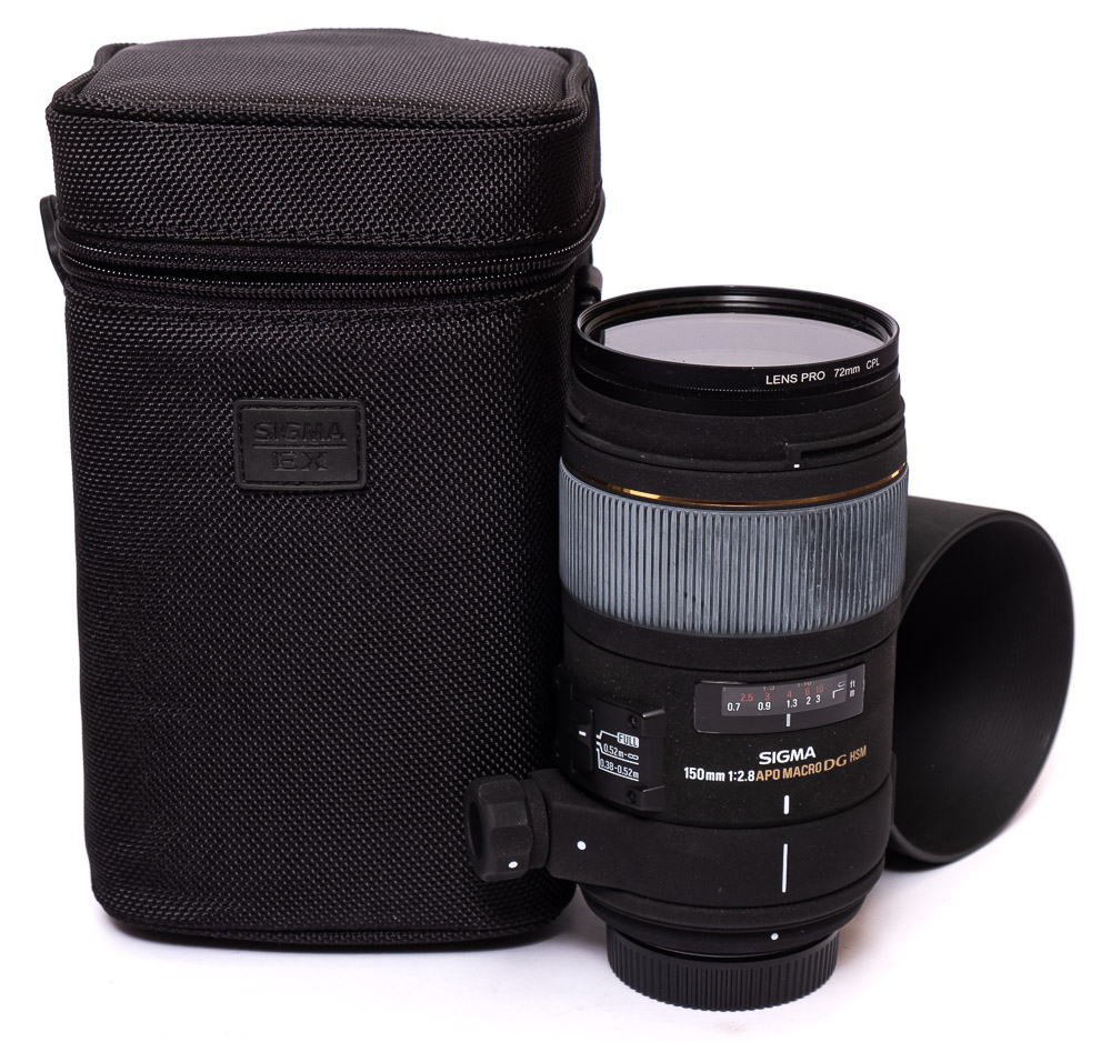 A Sigma 150mm f.2.8 APO macro DG lens in original box and bag.