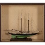 A cased model of a yacht: standing rigged over deck with grates, winch and fittings,