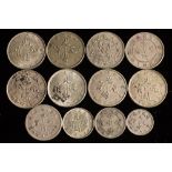 Twelve silver Chinese coins.