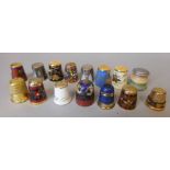 A collection of sewing thimbles: most with cloisonne enamel decoration,
