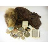 A Harrods fur stole, two other furs and a collection of mid 20th century powder compacts.