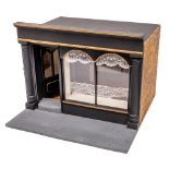 A wooden scale model of an Edwardian dress shop: the black glazed facade with fitted interior