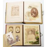 A late Victorian black leather Carte de Visite album dated 'Xmas 1894': containing various