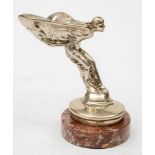 A Rolls-Royce Spirit of Ecstasy radiator mascot, mounted on a marble socle, 15cm high.
