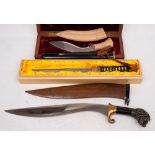 An Indian presentation kukri in case: the plaque inscribed 'With Best Compliments K A Nambiar,