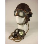 An RAF C type flying helmet together with two pairs of MK VIII. goggles.