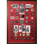 Two framed sets of reproduction German Foreign legion cloth badges.