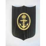 A Scandinavian ward room badge for the Kustflottan (Coastal Fleet): gilt on ebony plinth, 19cm high.