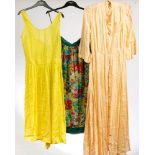 A collection of late 20th century skirts and textiles including a yellow cotton dress by French