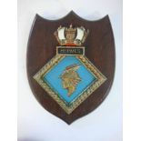 A ward room badge for HMS Hermes on wooden shield plinth: 33cm high.