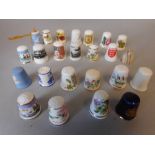 A collection of porcelain sewing thimbles: including jasperware examples, commemorative thimbles,