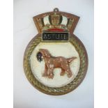 A ward room badge for HMS Astute on wooden plinth: 25.5cm high.