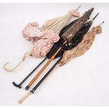 A group of five early 20th century parasols including a Chinese style paper parasol,
