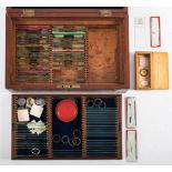A late 19th /early 20th century mahogany microscope slide case and contents: mostly entomological