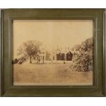 An early 20th century photograph of a croquet game at a country house,