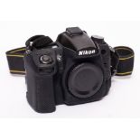A Nikon D7000 Digital camera serial number 2208403 with silicone body cover:,