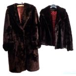 A mid 20th century brown fur coat by Tescan together with a black fur jacket by Clive: (2)