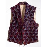 An Edwardian blue silk and maroon cut moquette waistcoat: with tree pockets.