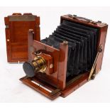 A Thornton Pickard mahogany and brass camera: fitted f8-64 brass lens,
