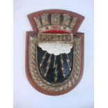 A ward room badge for HMS Jupiter: on wooden plinth, 23cm high.