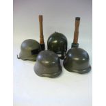 A group of three reproduction German helmets: together with a reproduction helmet with nose guard