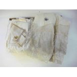 A collection of lace and cutwork items: including serviettes and a camisole.
