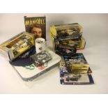 A collection of Nigel Mansell memorabilia: including a signed 1992 British GP programme,