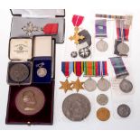 A collection of various medals and medallions including a Victorian Indian service medal (no