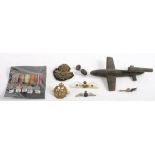 A WWII period scratch built wooden model of a V1 'Doodle Bug': together with three RAF sweet heart