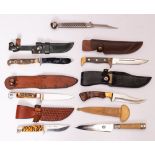A group of various hunting knives: including a Puma angler's knife with priest pommel,