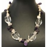 A decorative amethyst, rose quartz, clear quartz and freshwater pearl necklace with T bar clasp.