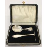 A boxed baby christening set of a spoon and pusher. Hallmarked Birmingham 1929.