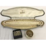 A vintage cased Lotus double string pearl necklace (in need of repair).