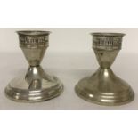 A pair of vintage 'Duchin Creation' sterling silver weighted candlesticks.