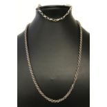 A silver 18" rope chain necklace together with a silver infinity and kisses link bracelet.